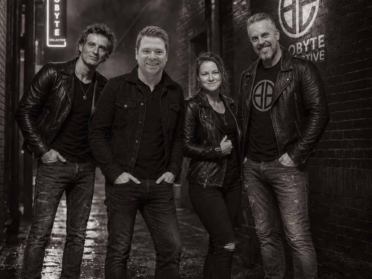 Band portrait in an alley under the Ecobyte Collective sign